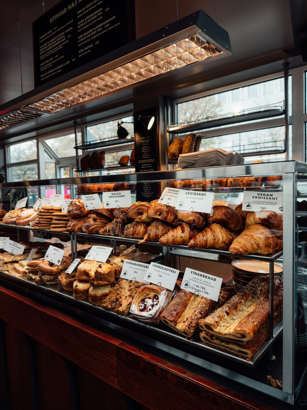 The bakery case full of pan dulce with price tags