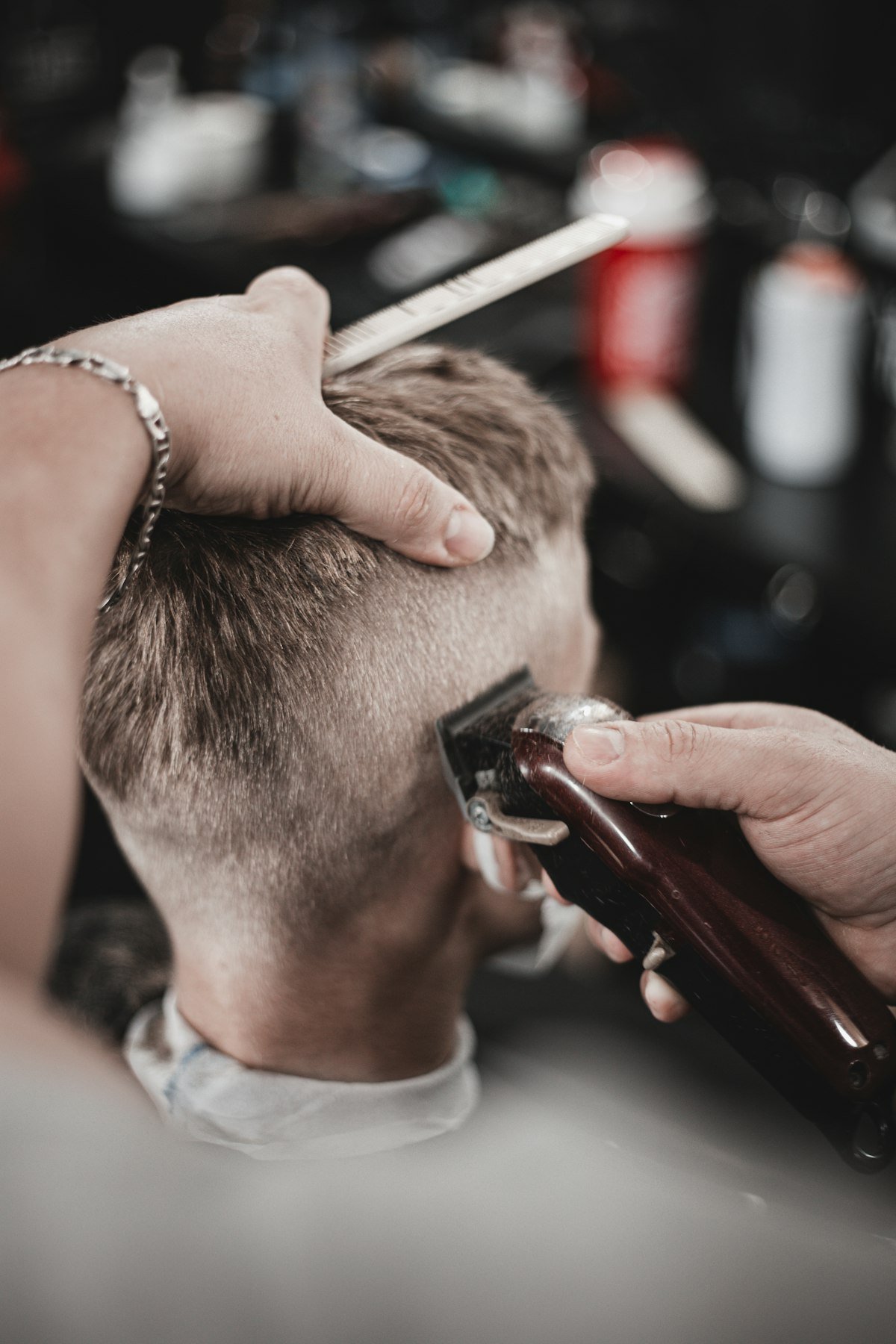 Close view of the clipper blending the side of a haircut