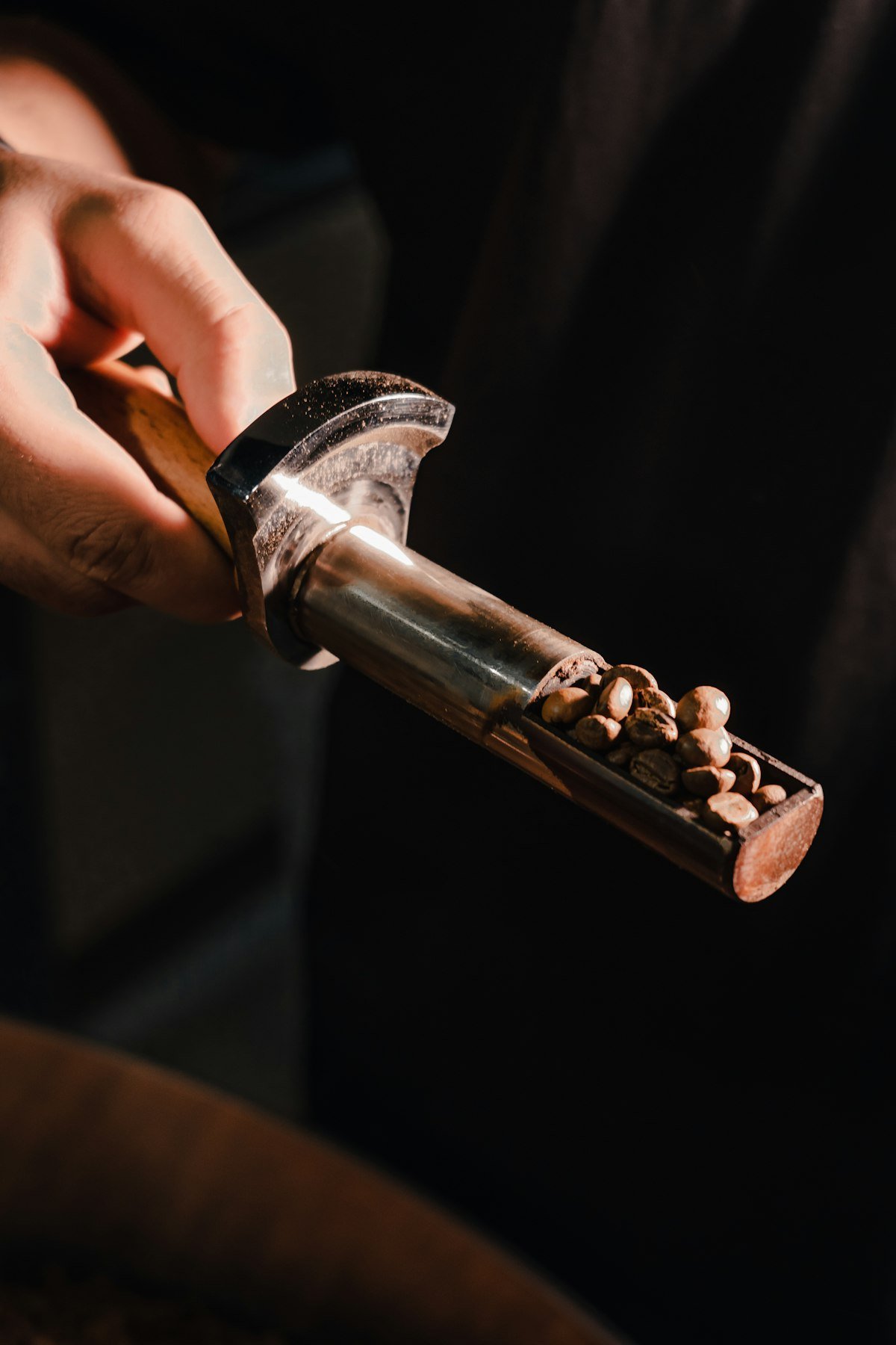 Scoop of roasted coffee beans