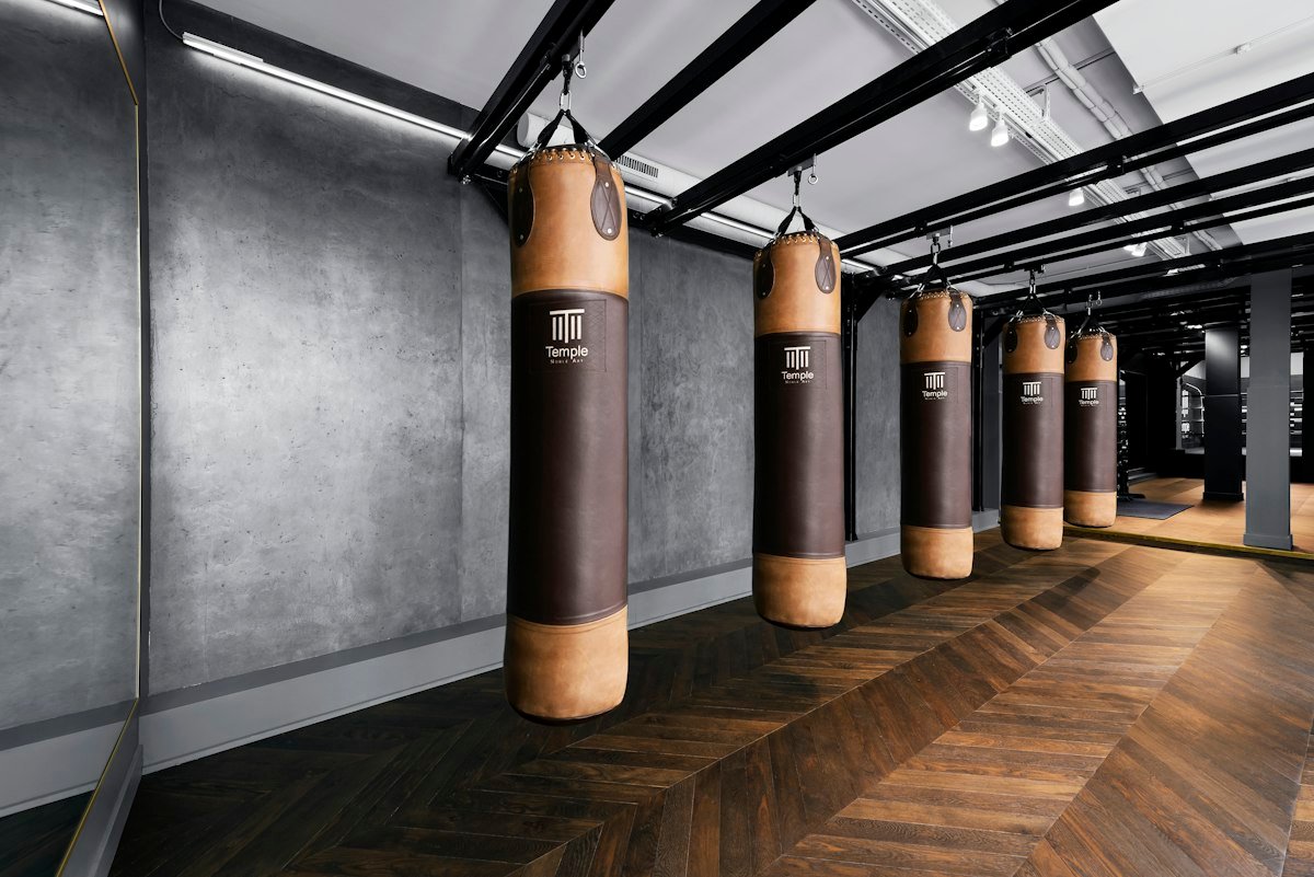 The row of heavy bags down the length of the gym