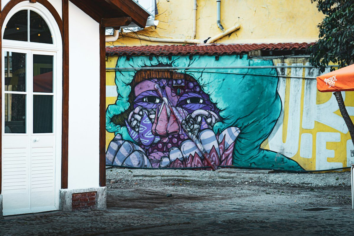 Painted mural on the wall down the block